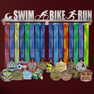 Swim Bike Run Medal Hanger Display V1 Triathlon Metal Rack holding colorful triathlon medals on a stainless steel rack with cutout icons.